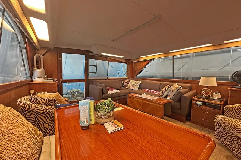 Slide: The Image of Luxurious interior of a 1988 Ocean Yachts 48 Super Sport with cozy seating and elegant decor. - 16