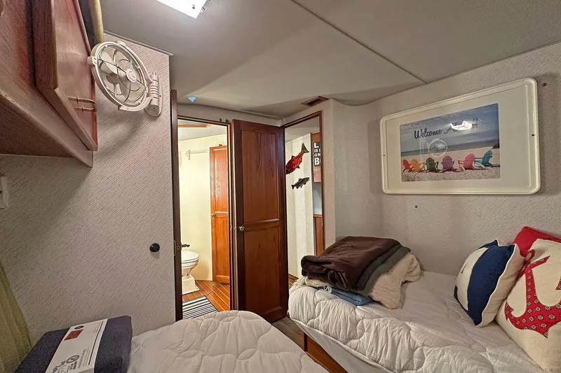 Slide: The Image of Cozy cabin interior of 1988 Ocean Yachts 48 Super Sport with nautical decor. - 22