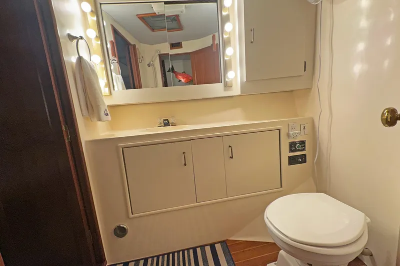 Slide: The Image of Bathroom interior of 1988 Ocean Yachts 48 Super Sport with vanity and toilet. - 24