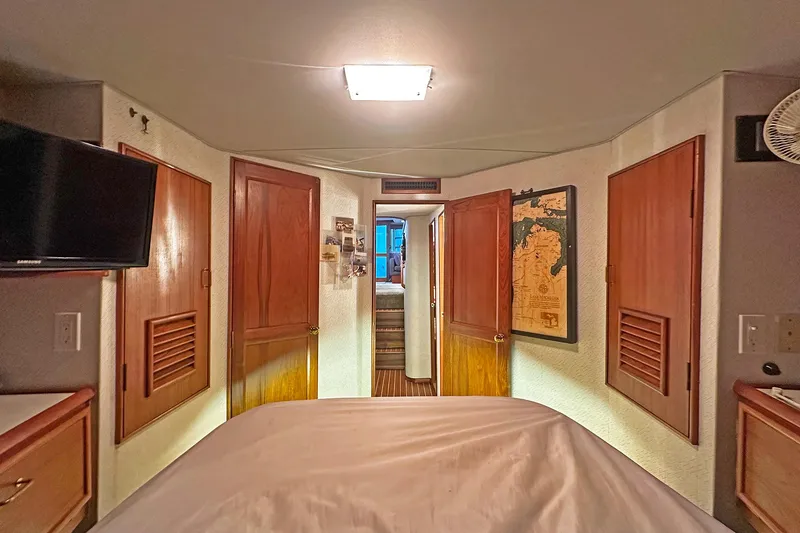 Slide: The Image of Interior cabin of 1988 Ocean Yachts 48 Super Sport with wood paneling and cozy decor. - 28