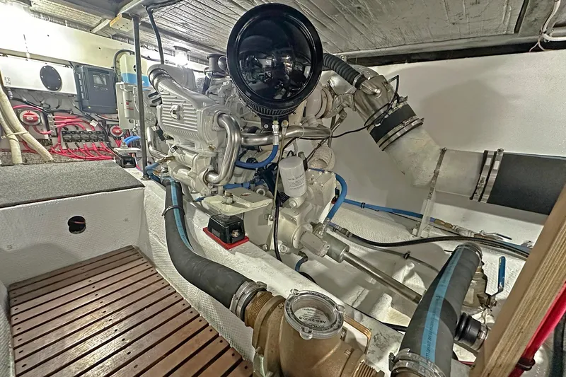 Slide: The Image of Engine room of a 1988 Ocean Yachts 48 Super Sport, showcasing mechanical components. - 31