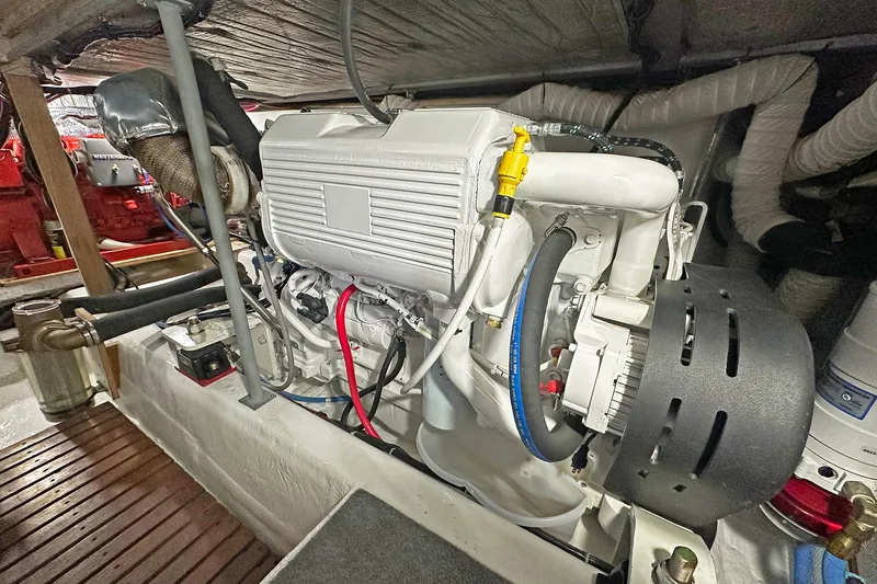 Slide: The Image of Engine room of a 1988 Ocean Yachts 48 Super Sport, showcasing detailed machinery. - 33