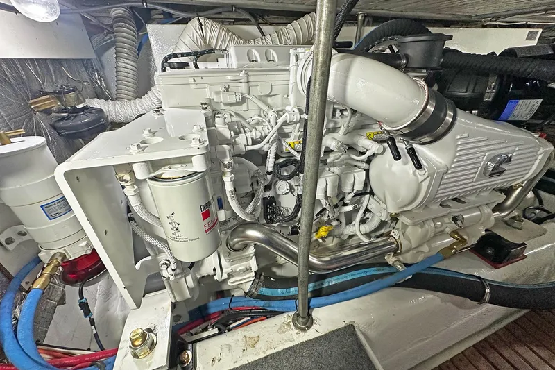 Slide: The Image of Engine room of a 1988 Ocean Yachts 48 Super Sport, showcasing detailed machinery. - 34