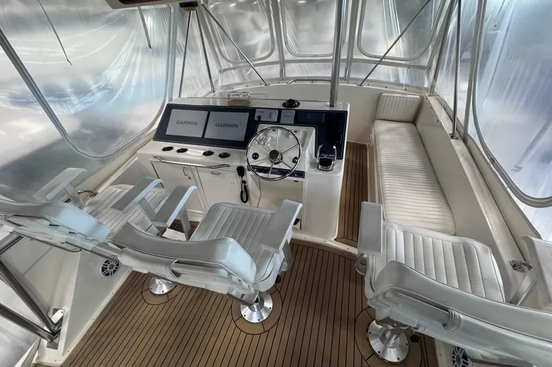 Slide: The Image of Cockpit of 1988 Ocean Yachts 48 Super Sport with Garmin navigation displays. - 38