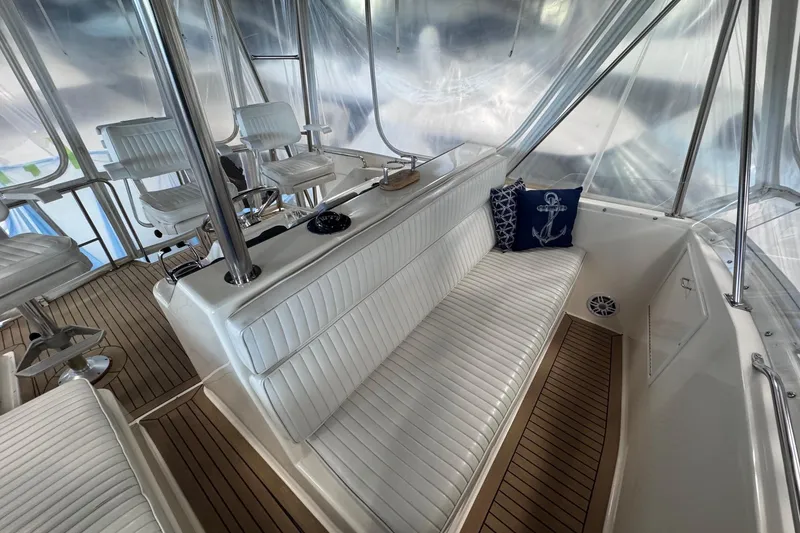 Slide: The Image of Interior of 1988 Ocean Yachts 48 Super Sport with white seating and nautical decor. - 43