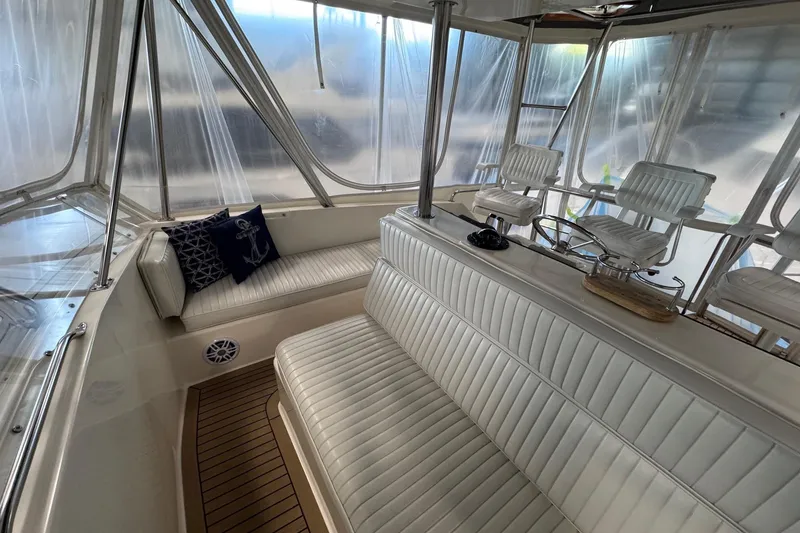 Slide: The Image of Interior of 1988 Ocean Yachts 48 Super Sport with white seating and nautical decor. - 45