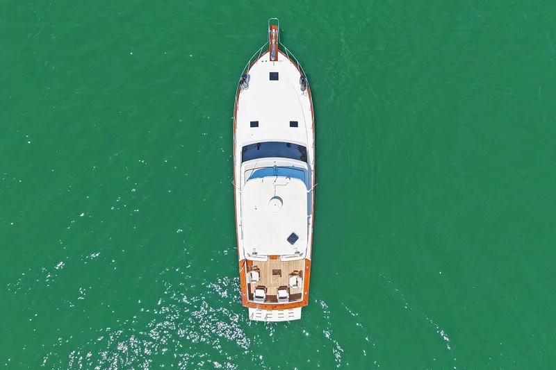 Slide: The Image of Aerial view of 1988 Ocean Yachts 48 Super Sport on green water. - 5