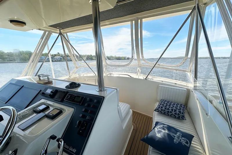 Slide: The Image of Cockpit view of 1988 Ocean Yachts 48 Super Sport, featuring helm and seating area. - 7