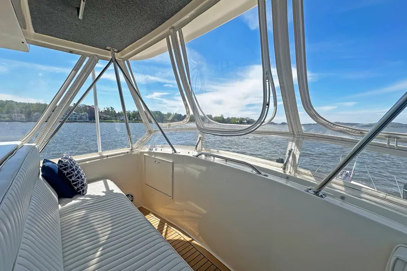 Slide: The Image of 1988 Ocean Yachts 48 Super Sport interior with panoramic water views and comfortable seating. - 8