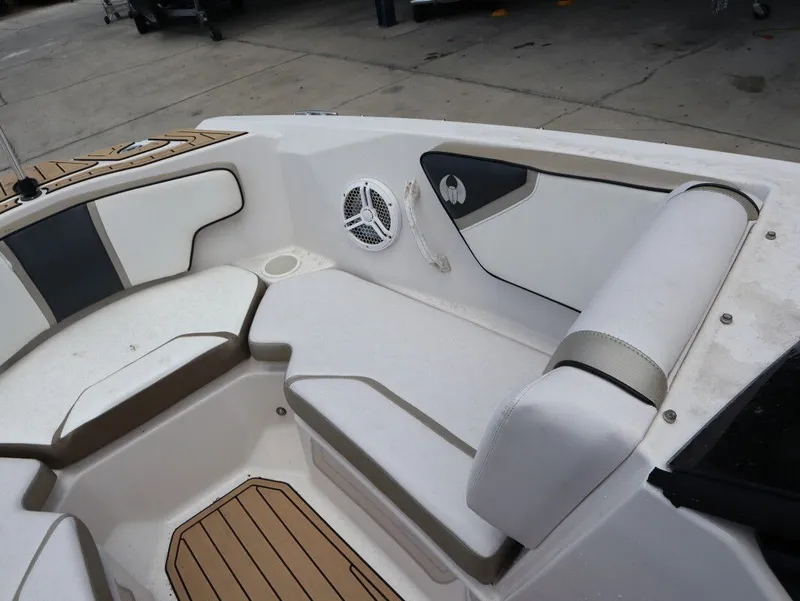Slide: The Image of Interior of a 2014 Scarab 215 boat with white seating. - 15