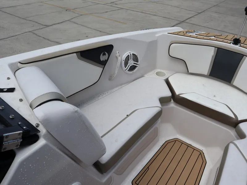 Slide: The Image of Interior of a 2014 Scarab 215 boat with seating area. - 16