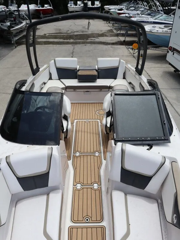 Slide: The Image of 2014 Scarab 215 boat interior with seating and deck. - 18
