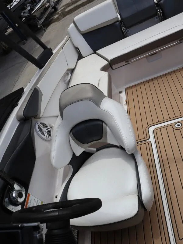 Slide: The Image of Interior of a 2014 Scarab 215 boat with white seating. - 20