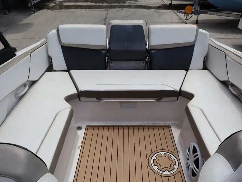 Slide: The Image of Interior of a 2014 Scarab 215 boat with seating area. - 21