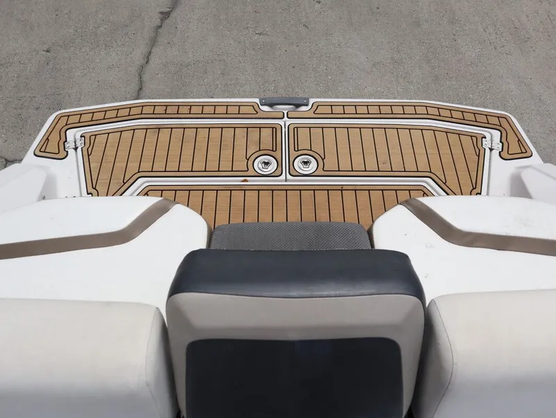 Slide: The Image of Rear view of 2014 Scarab 215 boat with wooden deck. - 22