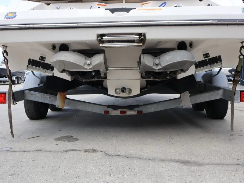 Slide: The Image of Rear view of a 2014 Scarab 215 boat on a trailer. - 9