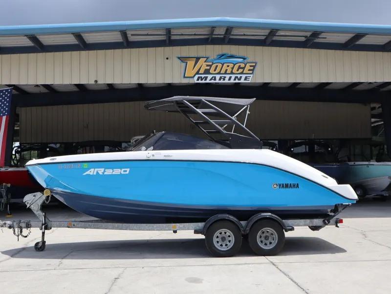 The Image of 2023 Yamaha AR220 boat in front of VForce Marine building. - 1