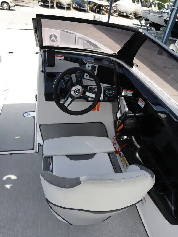 Slide: The Image of Interior of 2023 Yamaha Boats AR220 with steering console. - 10