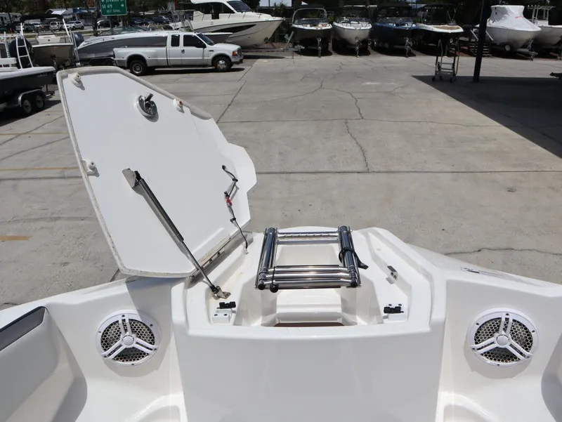 Slide: The Image of Yamaha AR220 2023 boat with open bow hatch and speakers. - 15