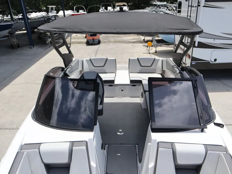 Slide: The Image of 2023 Yamaha AR220 boat with canopy and seating area. - 16