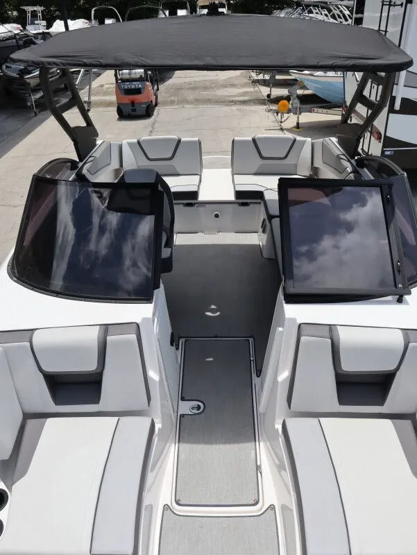 Slide: The Image of Interior view of a 2023 Yamaha Boats AR220 with seating area. - 17