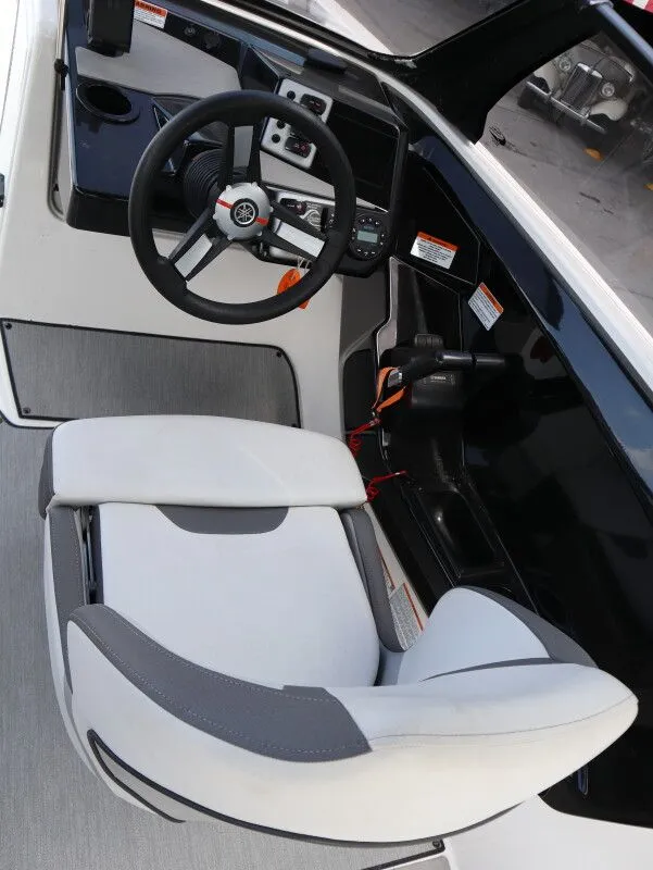 Slide: The Image of Interior of 2023 Yamaha Boats AR220 with steering console and seat. - 19