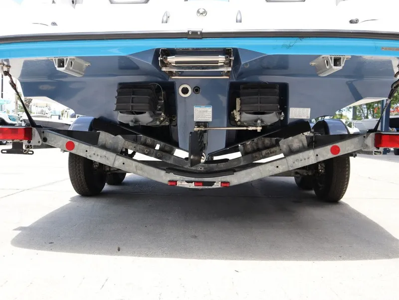 Slide: The Image of Rear view of a 2023 Yamaha AR220 boat on a trailer. - 25