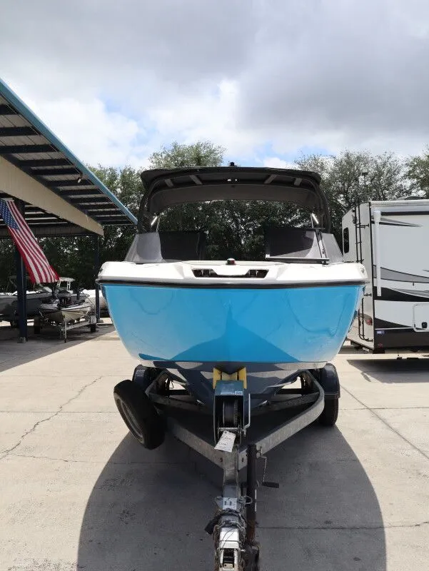Slide: The Image of 2023 Yamaha AR220 boat on trailer, blue, outdoors. - 3