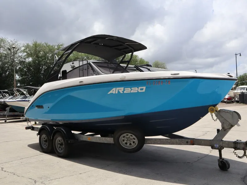 Slide: The Image of 2023 Yamaha AR220 boat on trailer, blue design. - 4