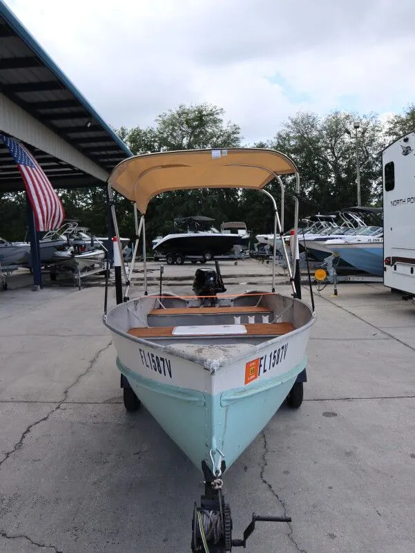 Slide: The Image of 1953 TDCM 16' Utility Fish Boat with canopy on trailer. - 4