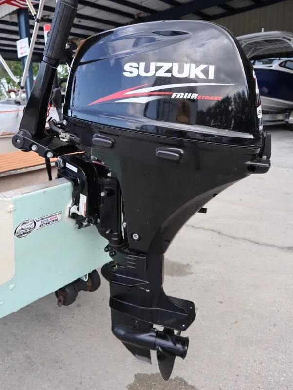 Slide: The Image of Suzuki outboard motor on a 1953 TDCM Utility Fish Boat. - 9
