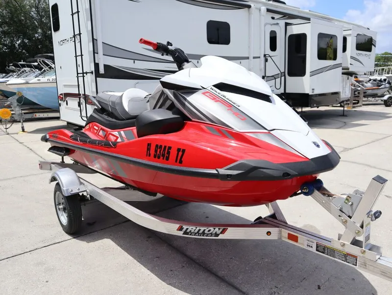 Slide: The Image of 2025 Yamaha GP 1900 HO jet ski on trailer, red and white. - 5