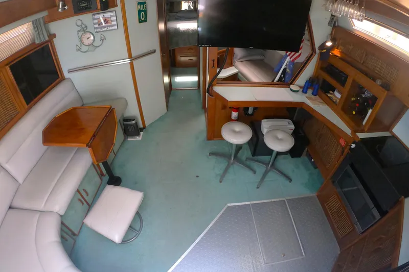 Slide: The Image of Interior of a 1987 Sea Ray 390 Express yacht salon with seating - 10