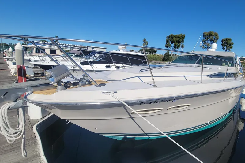 Slide: The Image of 1987 Sea Ray 390 Express yacht named "Southern Soul" on calm water, Los Alamitos Bay. - 2