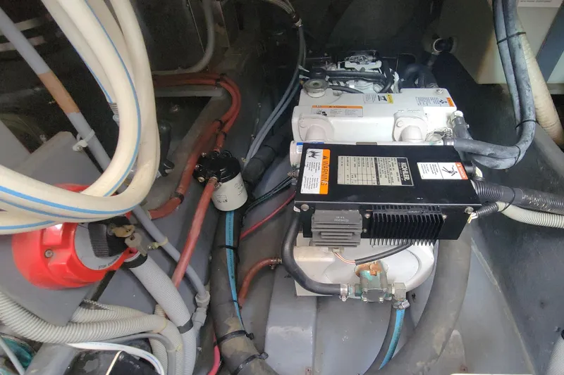 Slide: The Image of Engine compartment of a 1987 Sea Ray 390 Express with visible Kohler 7.4 generator. - 20