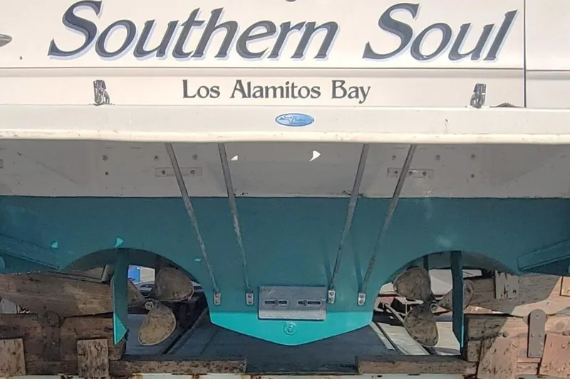 Slide: The Image of 1987 Sea Ray 390 Express "Southern Soul" at Los Alamitos Bay, showing propellers and hull. Fresh Bottom Paint, balanced props, cutlass bearings. - 21