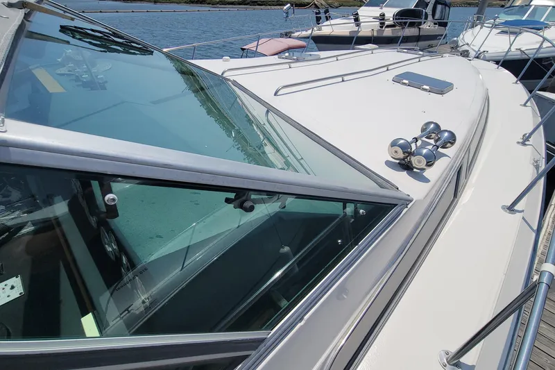 Slide: The Image of 1987 Sea Ray 390 Express yacht docked, showing safe wide walkway - 6