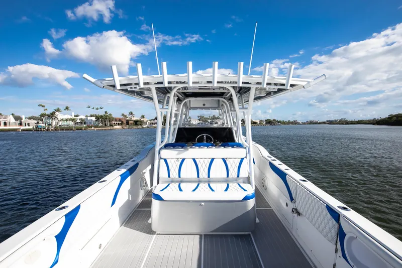 Slide: The Image of 2018 Hann 53 boat on water, clear sky, modern design, spacious deck. - 11