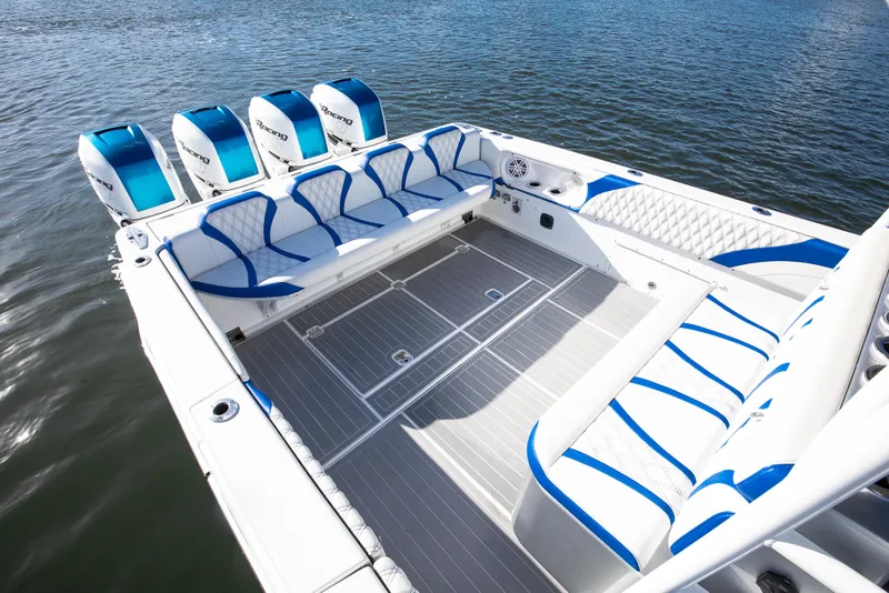 Slide: The Image of Luxury Hann 53 boat interior with blue and white seating, 2018 model, on water. - 13