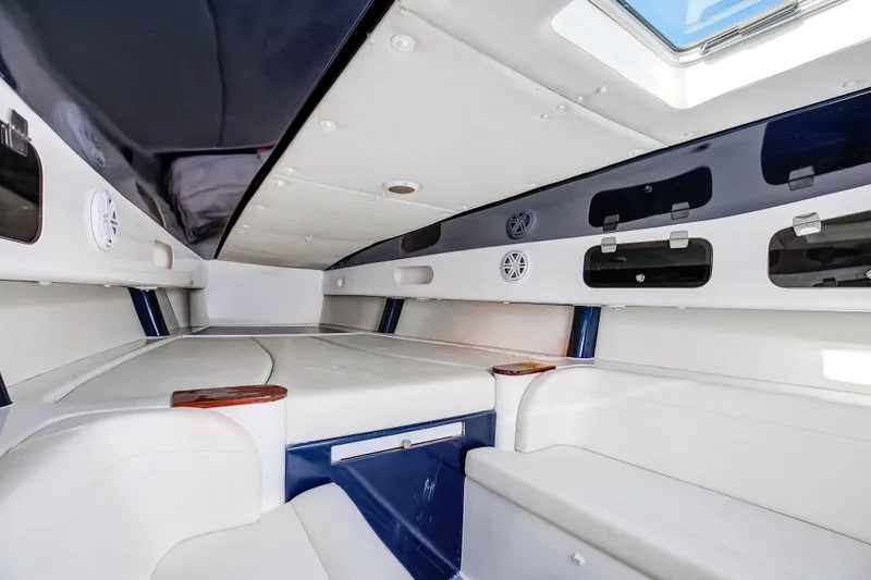 Slide: The Image of Interior of 2018 Hann 53 boat, featuring sleek white seating and modern design elements. - 15