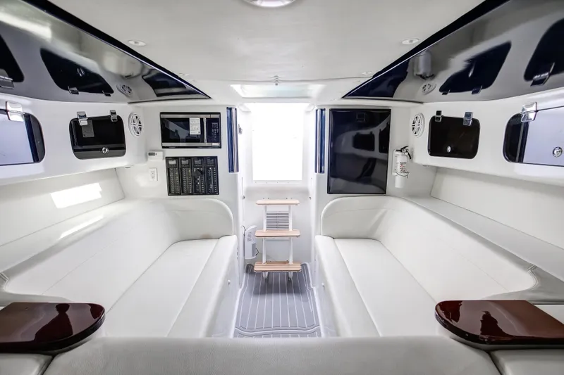 Slide: The Image of Luxurious interior of a 2018 Hann 53 boat, featuring white seating and modern amenities. - 16