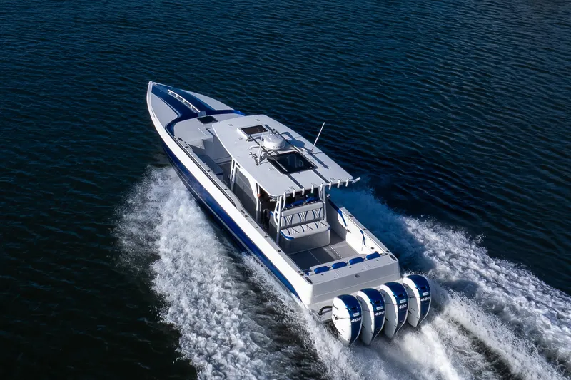 Slide: The Image of High-performance 2018 Hann 53 boat cruising on open water with powerful engines. - 20