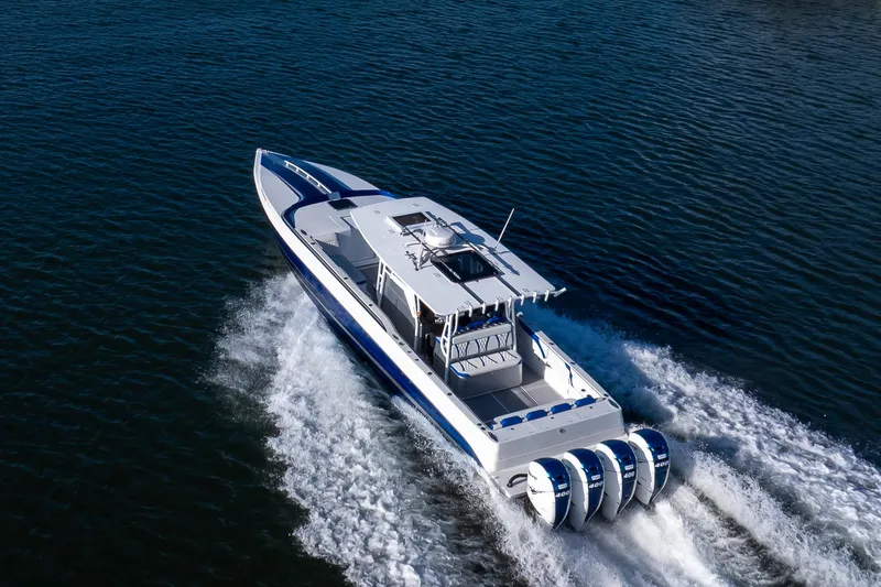 Slide: The Image of High-performance 2018 Hann 53 boat cruising on open water with powerful engines. - 21