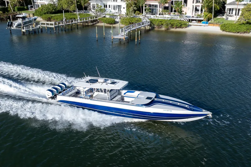 Slide: The Image of Aerial view of a 2018 Hann 53 boat cruising on a scenic waterway. - 25