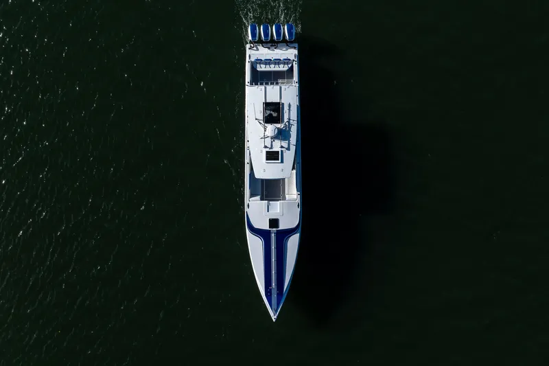 Slide: The Image of Aerial view of 2018 Hann 53 yacht cruising on dark water. - 29