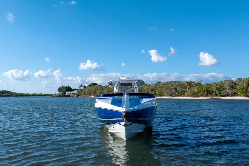 Slide: The Image of A 2018 Hann 53 boat on calm water with a clear blue sky. - 3