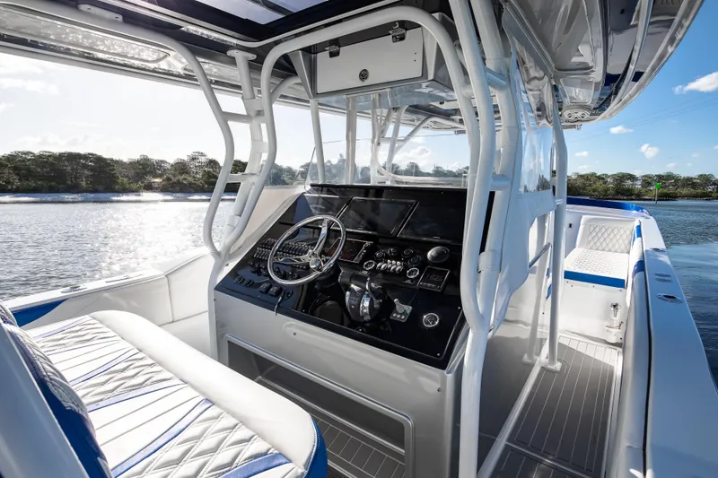 Slide: The Image of Interior view of 2018 Hann 53 boat cockpit with modern controls and seating. - 5