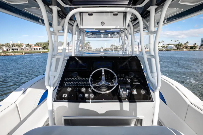 Slide: The Image of Cockpit view of 2018 Hann 53 boat with steering wheel and control panel. - 6