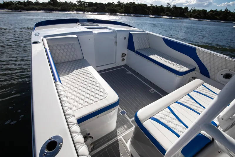 Slide: The Image of Luxurious 2018 Hann 53 boat interior with white and blue seating, on calm water. - 9