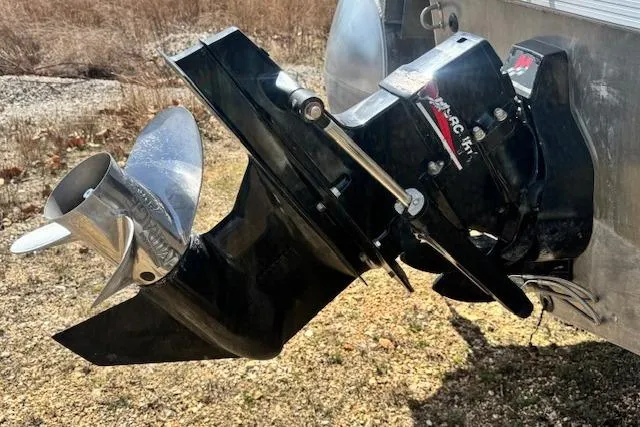 Slide: The Image of Outboard motor of a 2002 Bennington 2575RL I/O boat on dry land. - 23